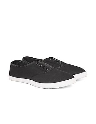 black canvas slip on sneakers